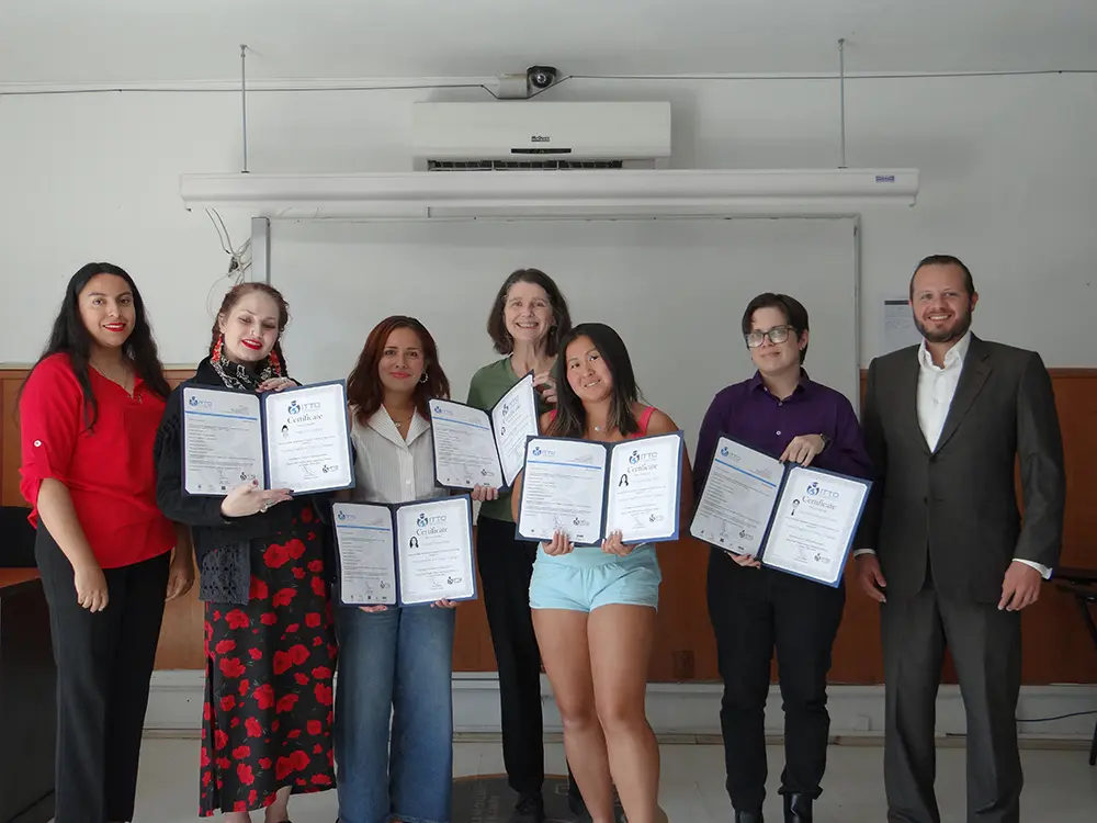 TEFL trainees holding their certificates at the end of a training course in Mexico