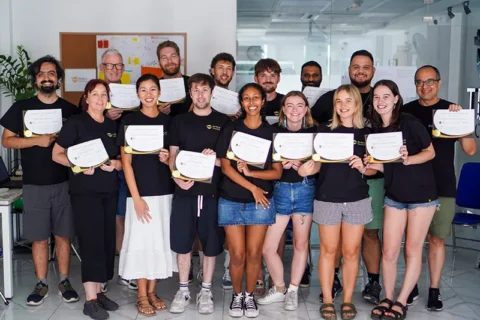 TEFL graduates and trainers with their certificates at the Ho Chi Minh City centre